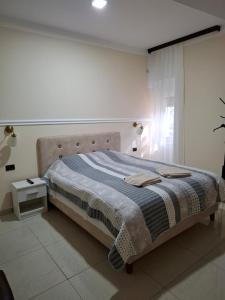 Postel nebo postele na pokoji v ubytování Bed&Breakfast INTERMEZZO CAFFE + 37 fotografií