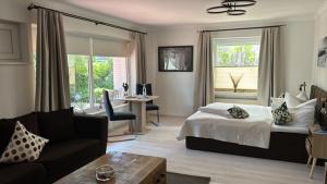 Postel nebo postele na pokoji v ubytování Garni Hotel & Appartements Nordstrand