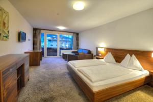 Postel nebo postele na pokoji v ubytování Hotel LukasMayr