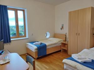 Postel nebo postele na pokoji v ubytování Centrum Mariapoli