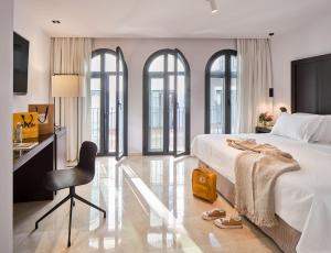 Posteľ alebo postele v izbe v ubytovaní Hotel Rey Alfonso X