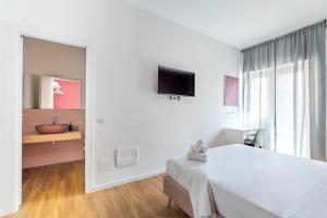 TV a/nebo společenská místnost v ubytování Relais Garbatella