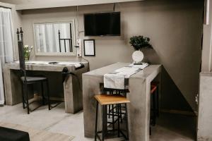 a kitchen with a sink and a counter with a bar at Overnight Stop Before Kruger National Park in Phalaborwa