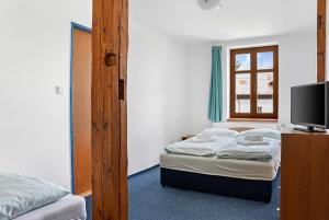 Postel nebo postele na pokoji v ubytování Hotel Franz