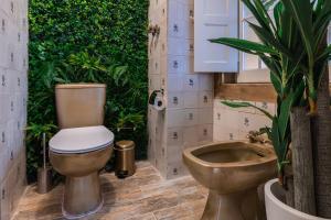a bathroom with a toilet and a sink at Small Cozy Room in Palace Patio with Hot Tub and Snooker - Sintra WOW in Sintra +30 photos