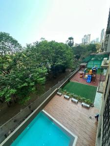 an overhead view of a swimming pool on a building at Residential Tranquil in Mumbai