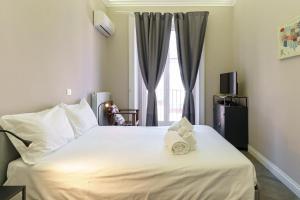 A bed or beds in a room at Felt in love in Catania