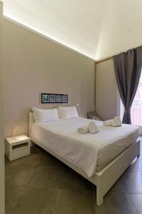 A bed or beds in a room at Felt in love in Catania