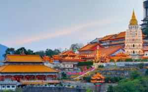 a group of buildings with orange roofs and a pagoda at Dou Houz Georgetown in George Town