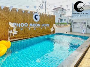 a swimming pool with a pool moon house sign on a fence at Phoo Moon House Khao Yai บ้านพัก ภู มูน เขาใหญ่ in Ban Bung Toei