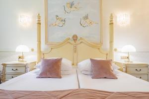 Ένα ή περισσότερα κρεβάτια σε δωμάτιο στο Dwór Prezydencki Boutique Hotel & SPA