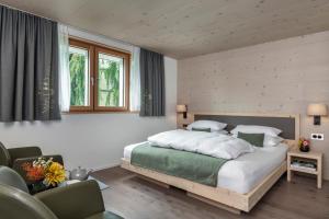 Postel nebo postele na pokoji v ubytování Dorfhus Gupf + 37 fotografií