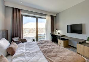 Postel nebo postele na pokoji v ubytování Hotel Emporia Mostar + 24 fotografií