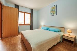 Posteľ alebo postele v izbe v ubytovaní Apartments Antonia