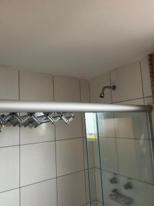 a shower in a bathroom with a shower curtain at Apto Golden Dolphin in Caldas Novas