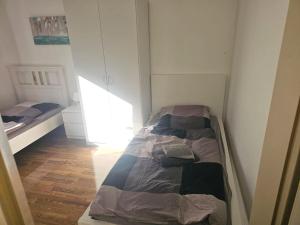 Llit o llits en una habitació de City Apartment Köln