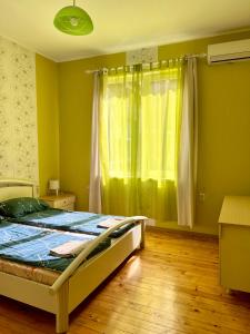 A bed or beds in a room at Serdika station, bright and cozy apartment