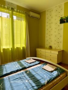 A bed or beds in a room at Serdika station, bright and cozy apartment