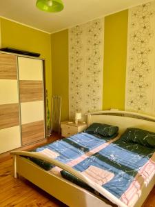 A bed or beds in a room at Serdika station, bright and cozy apartment