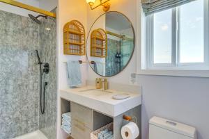 a bathroom with a sink and a mirror at Kalispell Mountain Getaway with Hot Tub and Fire Pit! in Kalispell +28 photos