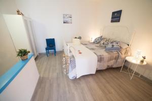 Postel nebo postele na pokoji v ubytování Appartamento Onda Luxury - MyHo Casa