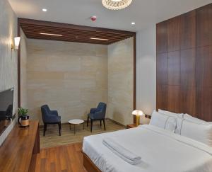 0484 Aero Lounge-Terminal 2 Cochin Airport Hotel客房内的一张或多张床位