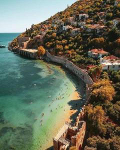an aerial view of a beach with people in the water at My Boutique Hotel in Alanya
