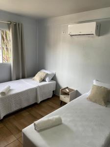 Ένα ή περισσότερα κρεβάτια σε δωμάτιο στο Casa nova e acongegante +12 φωτογραφίες