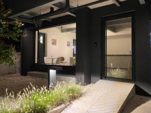a house with a large mirror on the side of it at THE CELESTRAIL - Apartment - Check-In by Appointment Only - Non-hotel - Onnut BTS in Bangkok