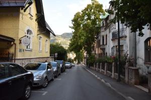 una calle con coches aparcados al costado de la carretera en Charming Studio in City Center-Excellent Location, en Sarajevo