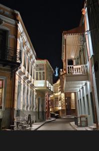 an empty city street at night with buildings at Tbilisi Heart in Tbilisi City