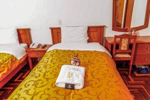 Postel nebo postele na pokoji v ubytování Inkas Peru Hostal