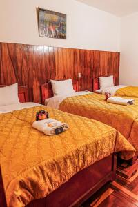 Postel nebo postele na pokoji v ubytování Inkas Peru Hostal