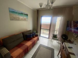 Posezení v ubytování Sol e Mar apto perto da praiapiscina e varanda Massaguaçu