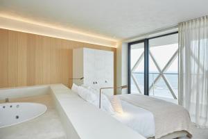Postel nebo postele na pokoji v ubytování C-Hotels Silt