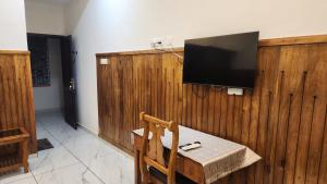 TV a/nebo společenská místnost v ubytování Divine Bliss Beach Resort