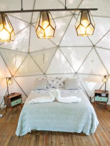 Postel nebo postele na pokoji v ubytování La Chagra VIP - Glamping en Villavicencio