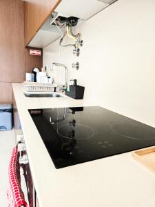 a kitchen with a sink and a counter top at Apartament F&M in Braga