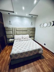 a bedroom with a large bed in a room at dar leena in Essaouira