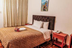 Postel nebo postele na pokoji v ubytování Inkas Peru Hostal