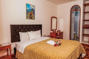 Postel nebo postele na pokoji v ubytování Inkas Peru Hostal
