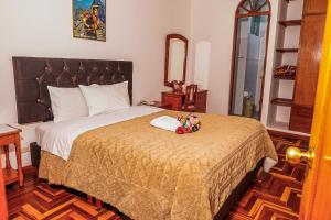 Postel nebo postele na pokoji v ubytování Inkas Peru Hostal