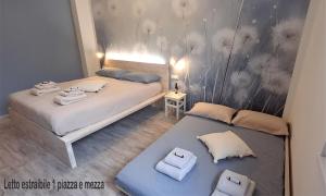 Postel nebo postele na pokoji v ubytování Magazzini Sasso Guest House