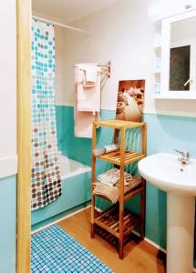a bathroom with a sink and a toilet and a shower at Días de Sur in Santander +28 photos