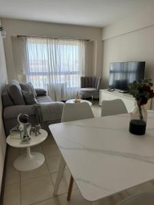 a living room with a couch and a table at Arena1 in Mar del Plata