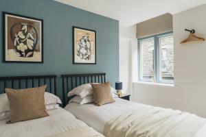 Ένα ή περισσότερα κρεβάτια σε δωμάτιο στο Aspen Suite, The Old Bank House