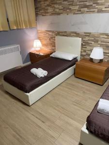 Postel nebo postele na pokoji v ubytování Milano 3 Astra Apartments & Rooms PT