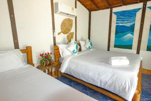 Marazao Beach Hotel & Spa客房内的一张或多张床位