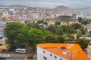 an aerial view of a city with buildings and cars at Sunset Plateau in Praia