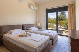 Posteľ alebo postele v izbe v ubytovaní Nema Villas + 37 fotografií
